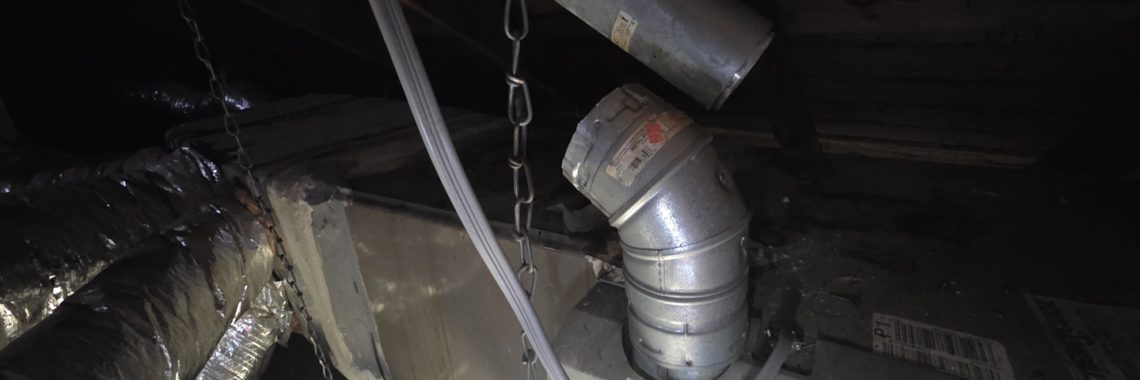 Disconnected metal furnace flue vent found in an attic